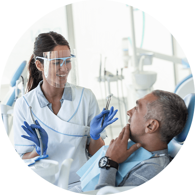 dental staff smiling with patient
