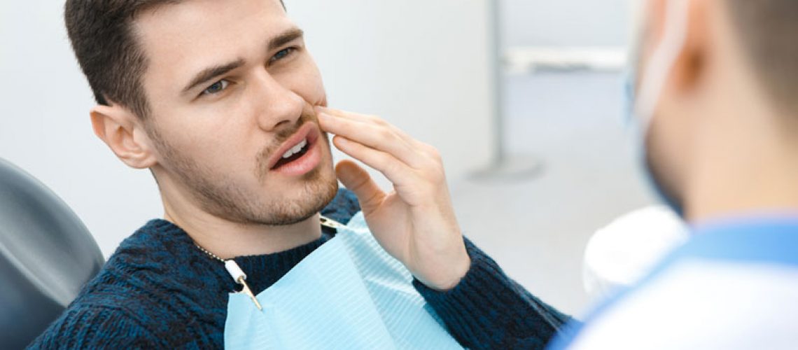 Dental Patient Suffering From Mouth Pain On A Dental Chair, In San Francisco, CA